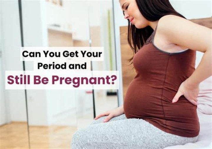 Can I be pregnant and still have brown discharge?