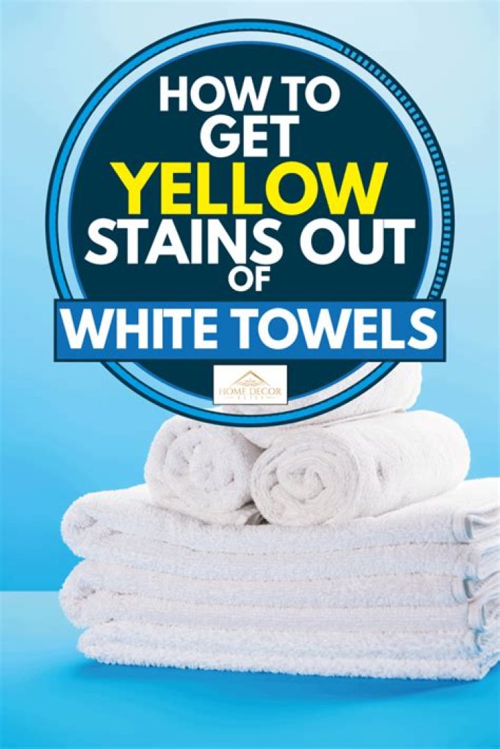 What causes yellow stains on white towels?
