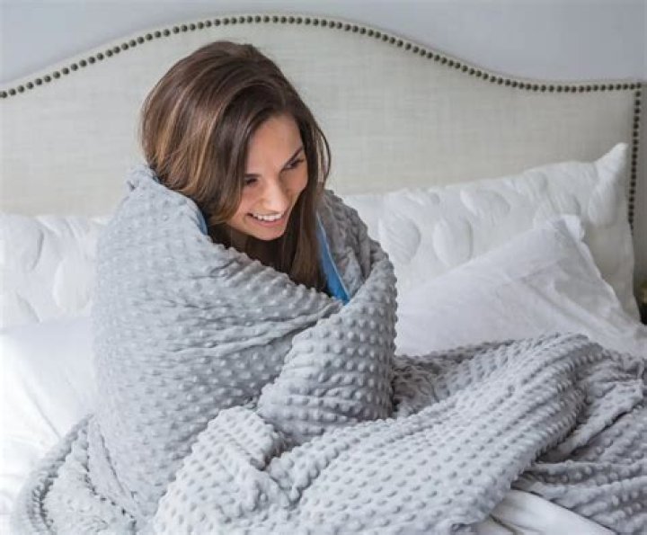 What is the best way to sleep with a weighted blanket?