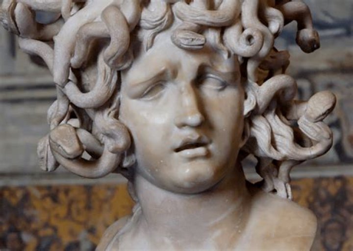 Who curses Medusa?