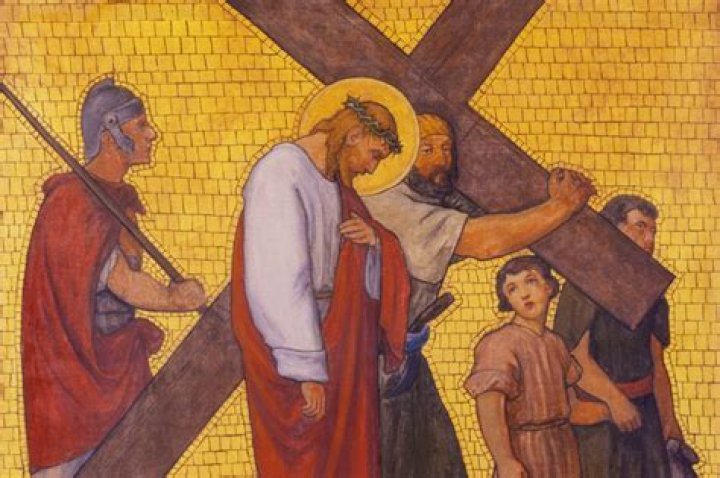 Who helped Jesus carry his cross?